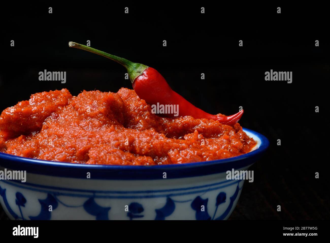 Red thai curry paste and chili pepper in shell hires stock photography