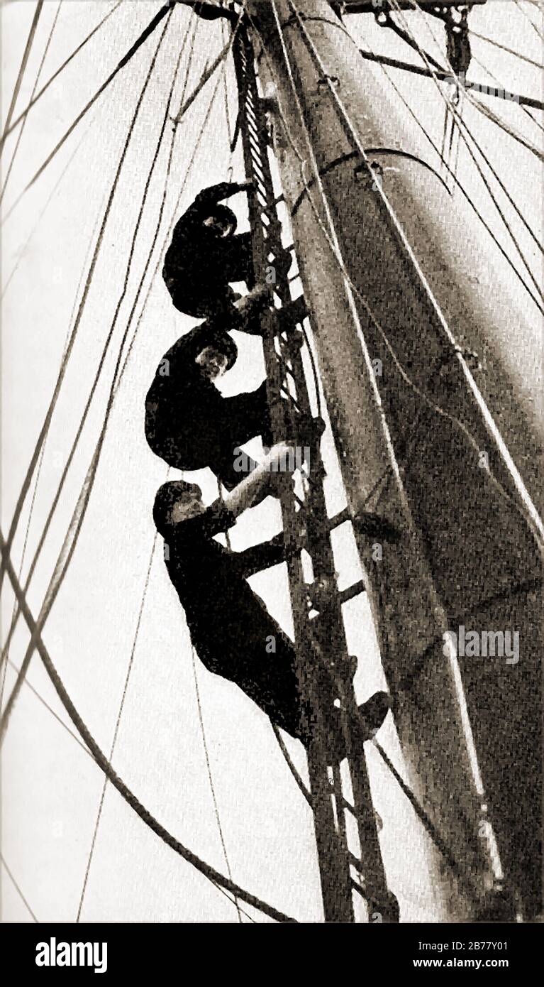 Naval cadets climbing the mast on the M.V. Chindwara a  British merchant navy cadet training ship (January 1950 until June 1963) - staffed by a Chief Petty Officer, and  2 deputies, named  Petty Officers.The vessel was launched on 12th May 1949, and built by Swan, Hunter and Wigham Richardson Limited, Newcastle, UK. in 1966, she was given a new role (cadet training unit), continuing in this capacity untill she was sold in 1971. Stock Photo