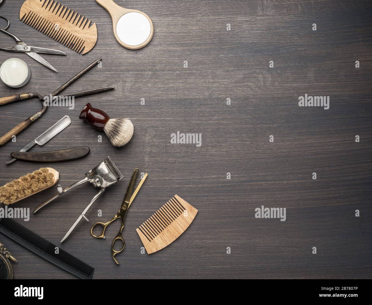 Hairdressing Instruments Classic grooming and hairdressing tools on wooden background. Top view ...