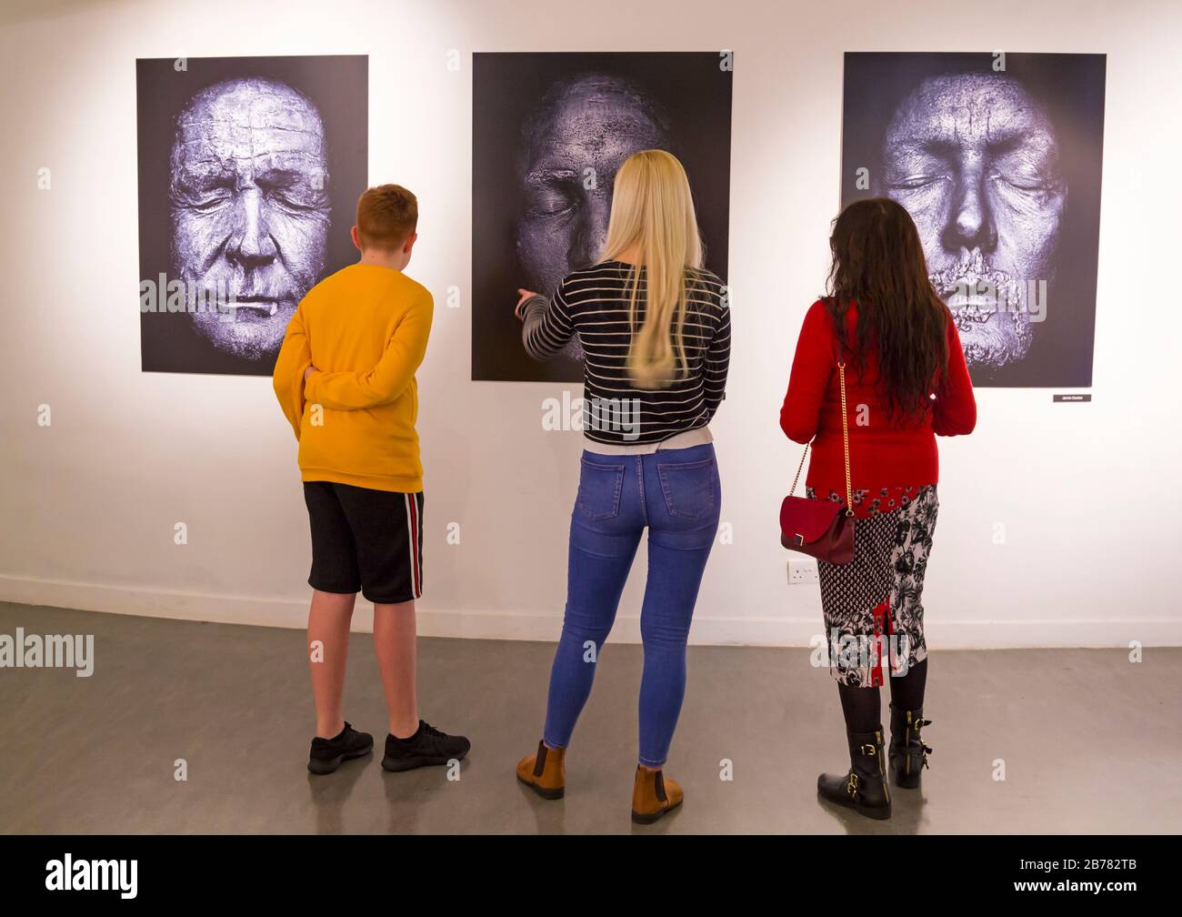 Poole, Dorset, UK.  14th March 2020. Opening of ALIVE: IN THE FACE OF DEATH exhibition of photographs by Rankin in collaboration with Forest Holme Hospice Charity in Poole. Rankin sets out to explore and challenge our perceptions of death, portraying stories of those touched by death, a celebration of life and diversity rather than focusing on death itself. It features a series of haunting monochrome ‘life mask’ portraits of casts made from the faces of famous celebrities and colourful masks echoing the Mexican Day of the Dead celebrations. Credit: Carolyn Jenkins/Alamy Live News Stock Photo