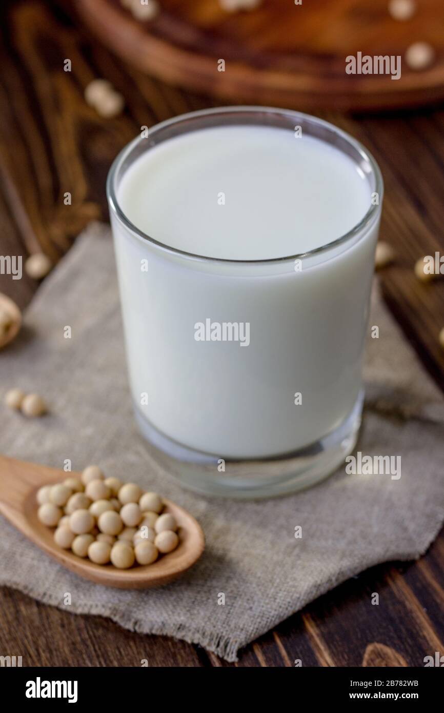 Soy milk with soy beans around it Stock Photo Alamy