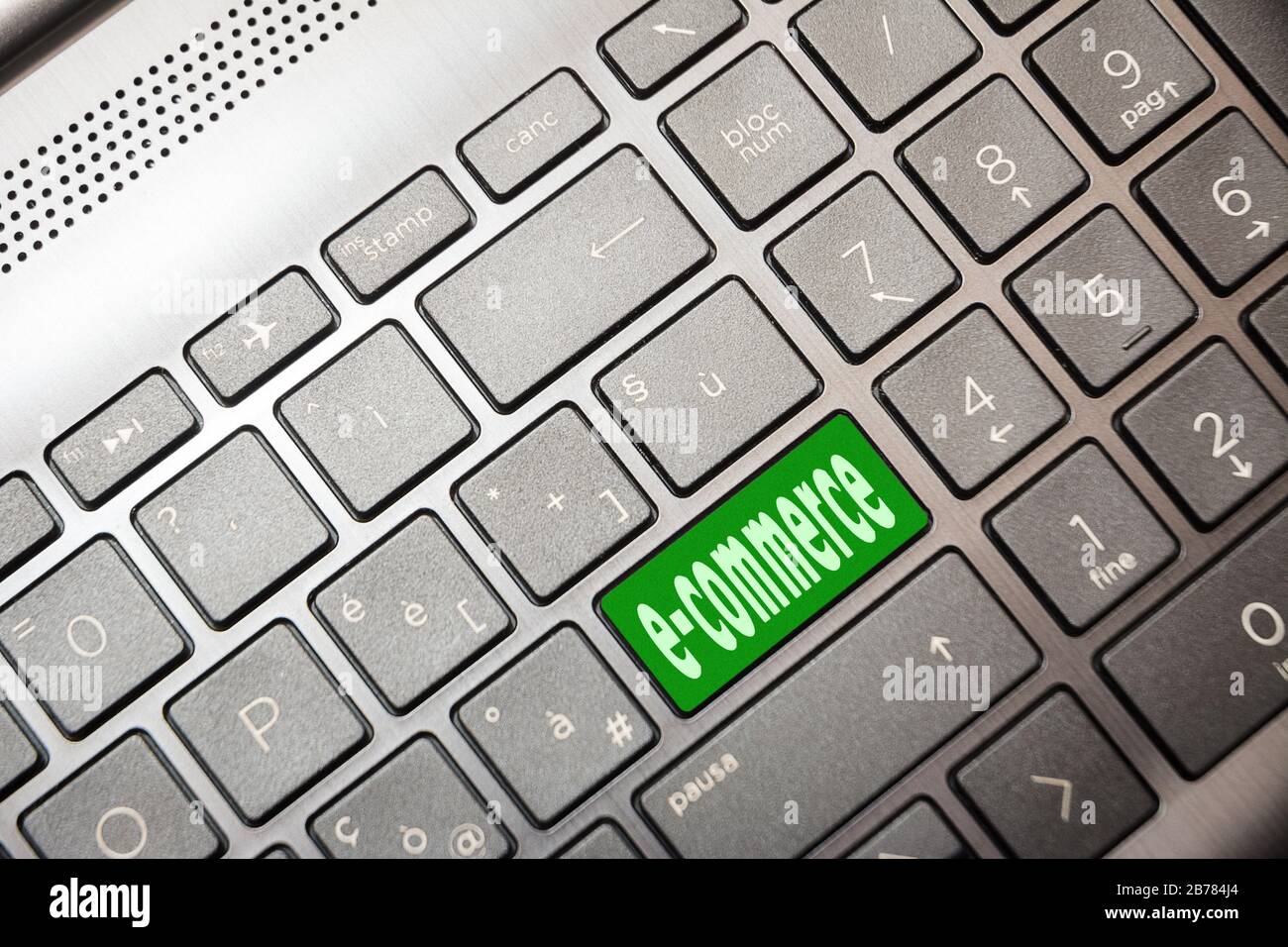 Green button on the computer with the text e-commerce Stock Photo