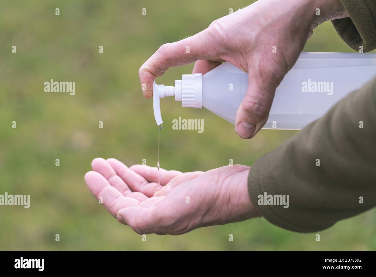 Using alcohol gel sanitizer to clean or wash hands. Anti virus bacteria protection against Corona virus convid19.  Protection outdoors against virus i Stock Photo