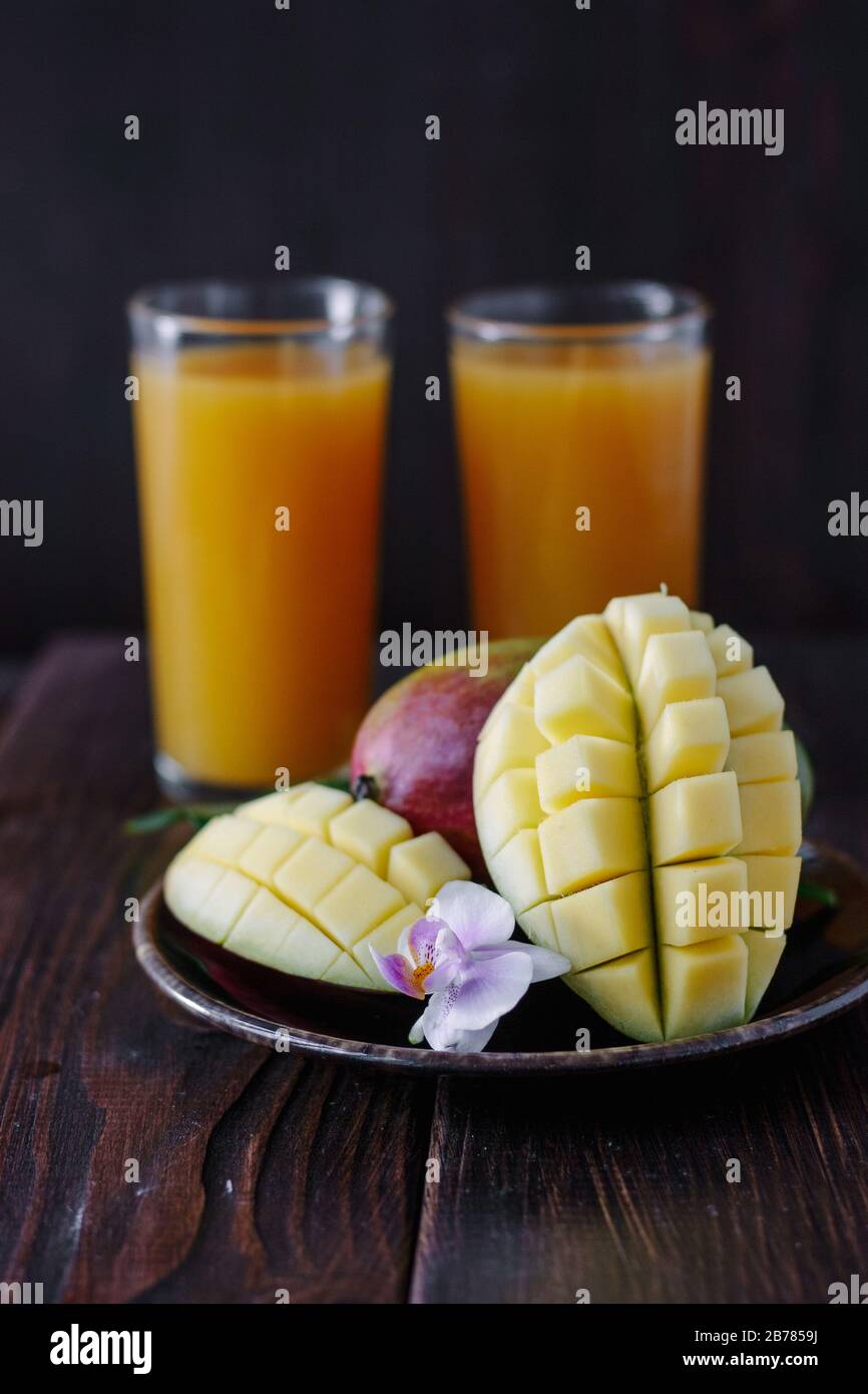Mango fruits over wooden table as healthy food concept Stock Photo Alamy