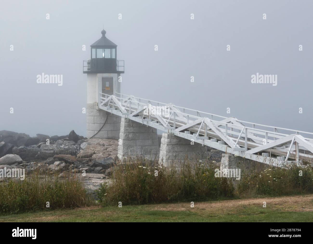 The Marshall Point Lighthouse has its light on during a very foggy