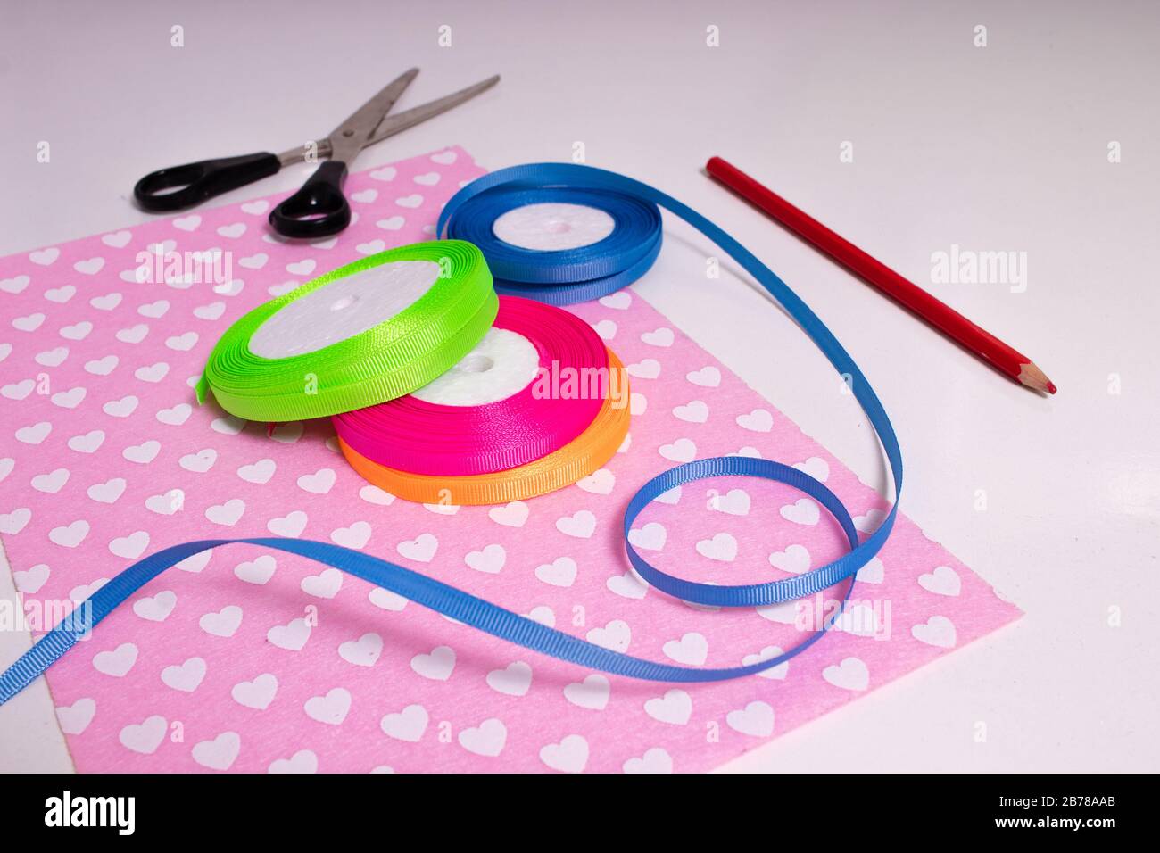 Multicolored ribbons for handmade products. Passion for the soul Stock Photo