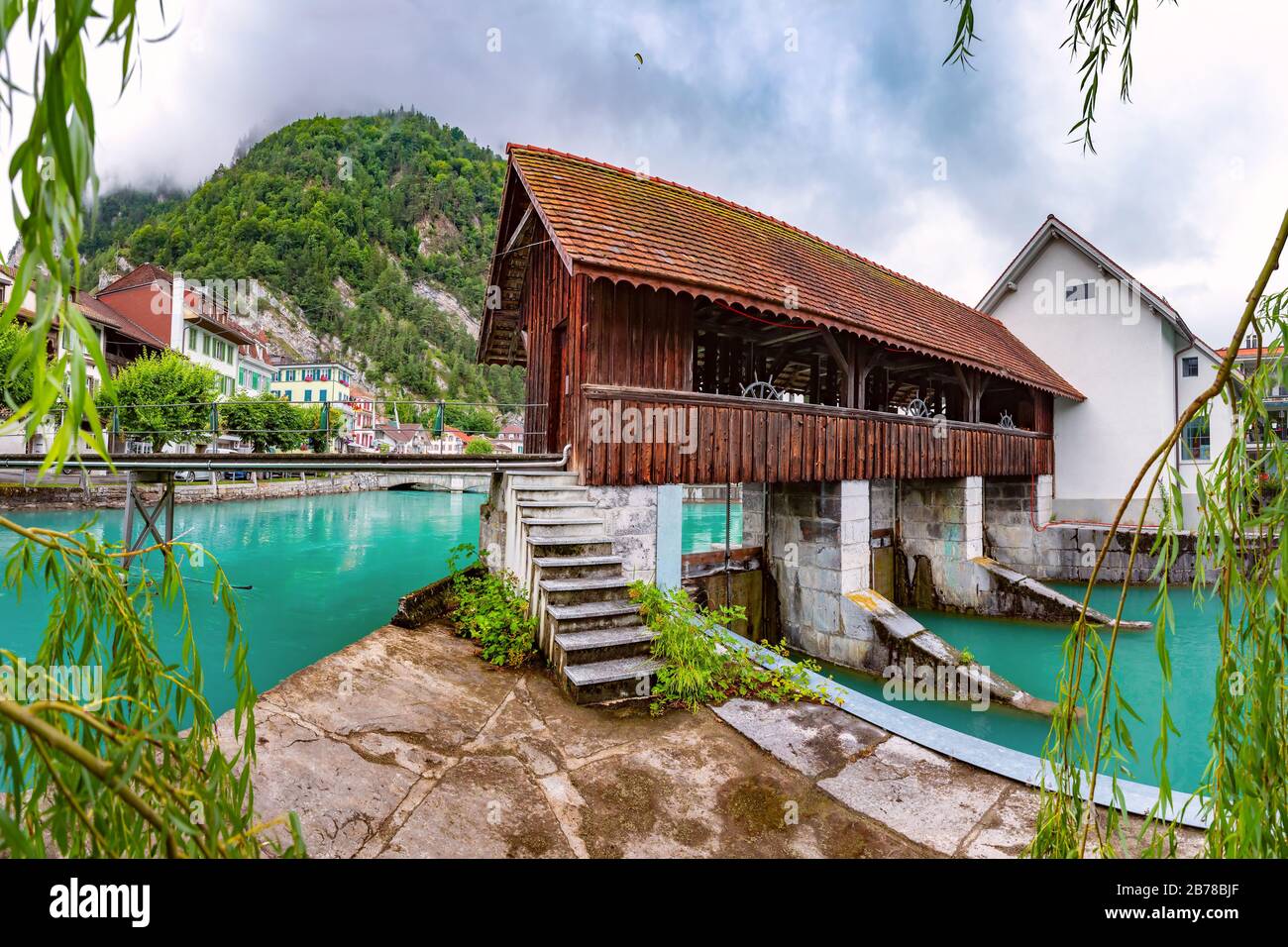 Panoramic view of weir on Aare river of Old City of Unterseen, Interlaken, important tourist center in the Bernese Highlands, Switzerland Stock Photo