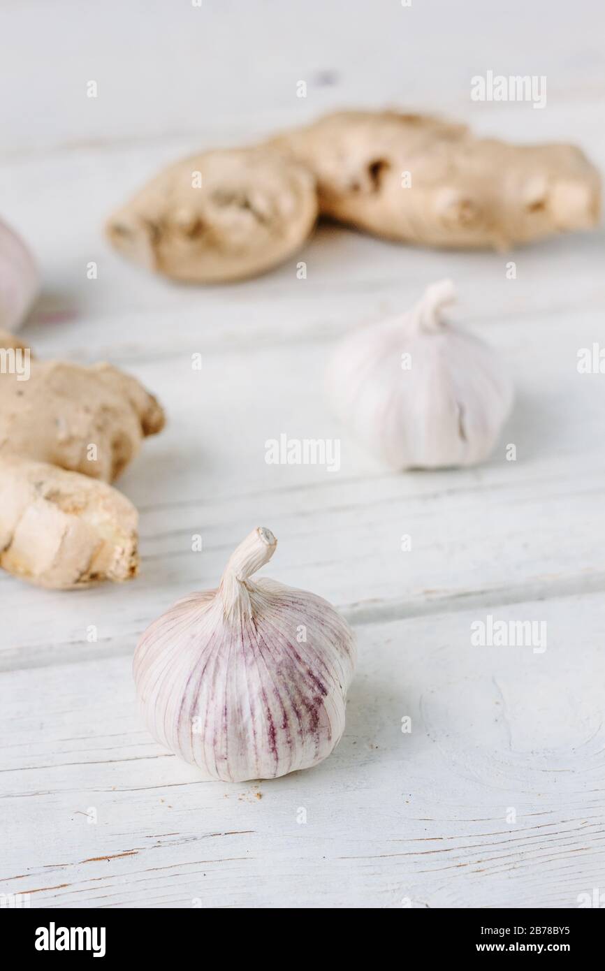 Garlic and ginger on white wooden surface Stock Photo - Alamy