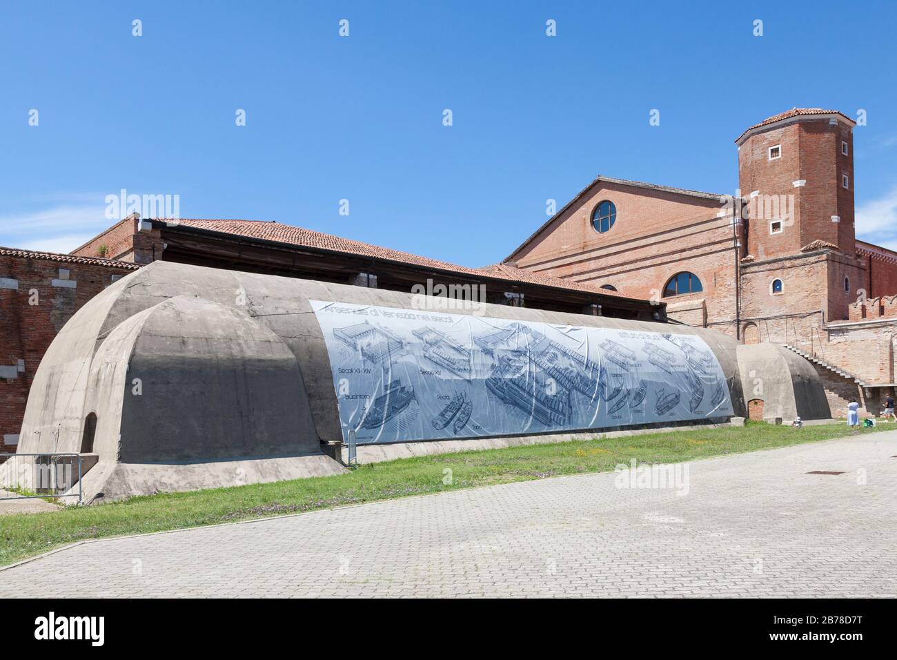 Concrete munitions storage bunker in the Arsenal or Arsenale , Venice, Italy with inforgaphic  showing the history of the  medieval Naval shipyard and Stock Photo