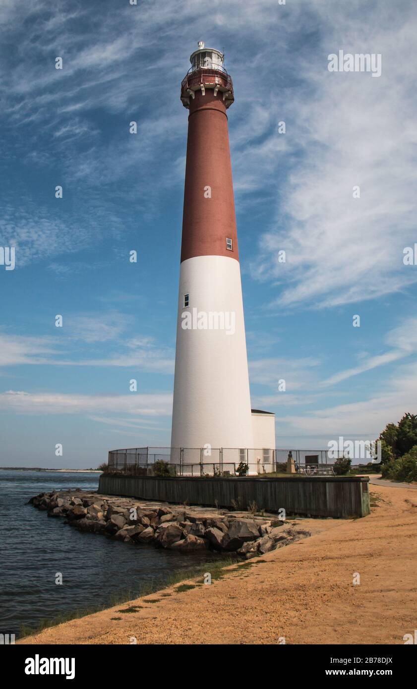 Barnegat Lighthouse on Long Beach Island, New Jersey against a blue sky