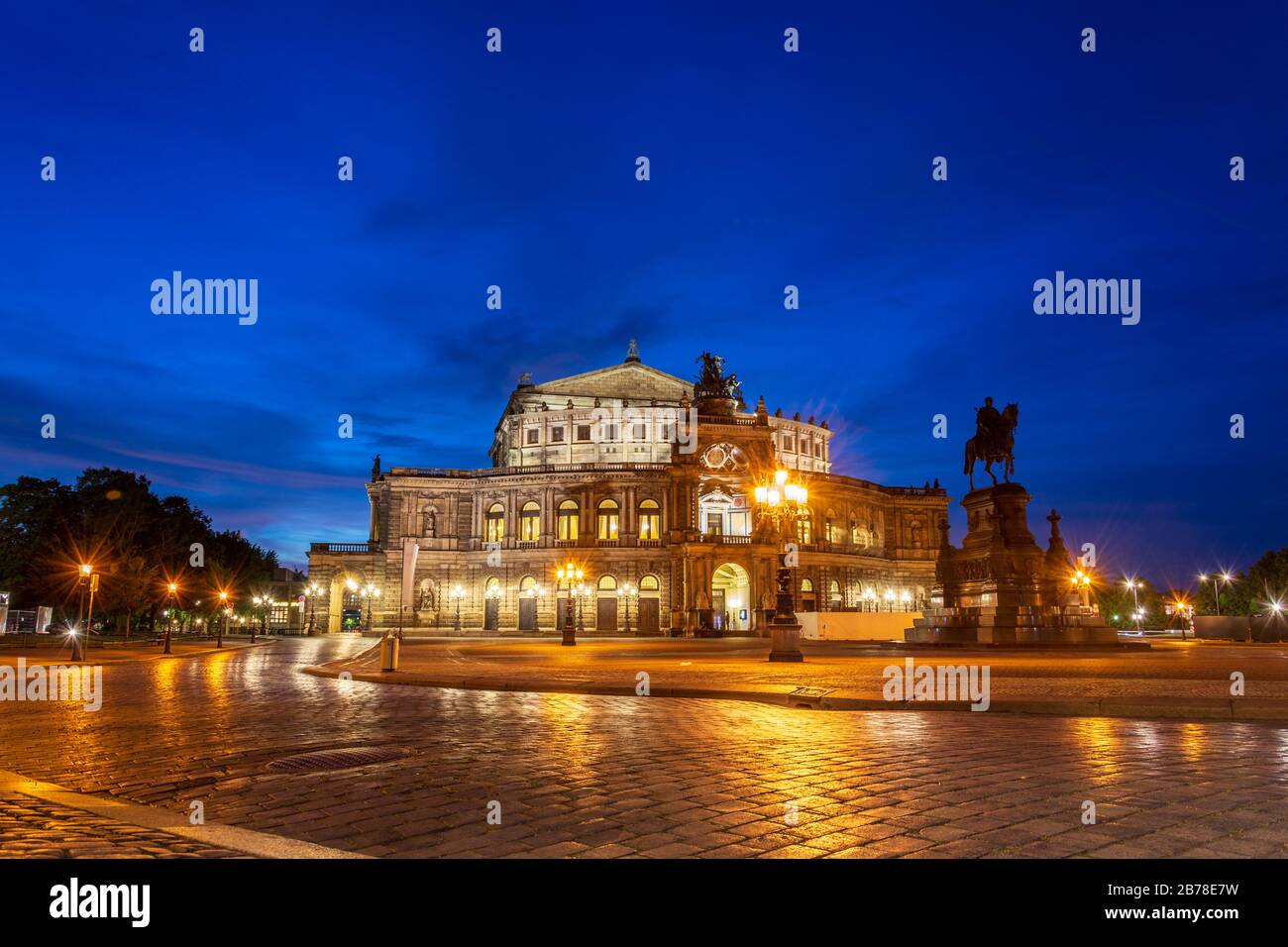 The famous opera house Semperoper lit in Dresden during blue hour Stock Photo