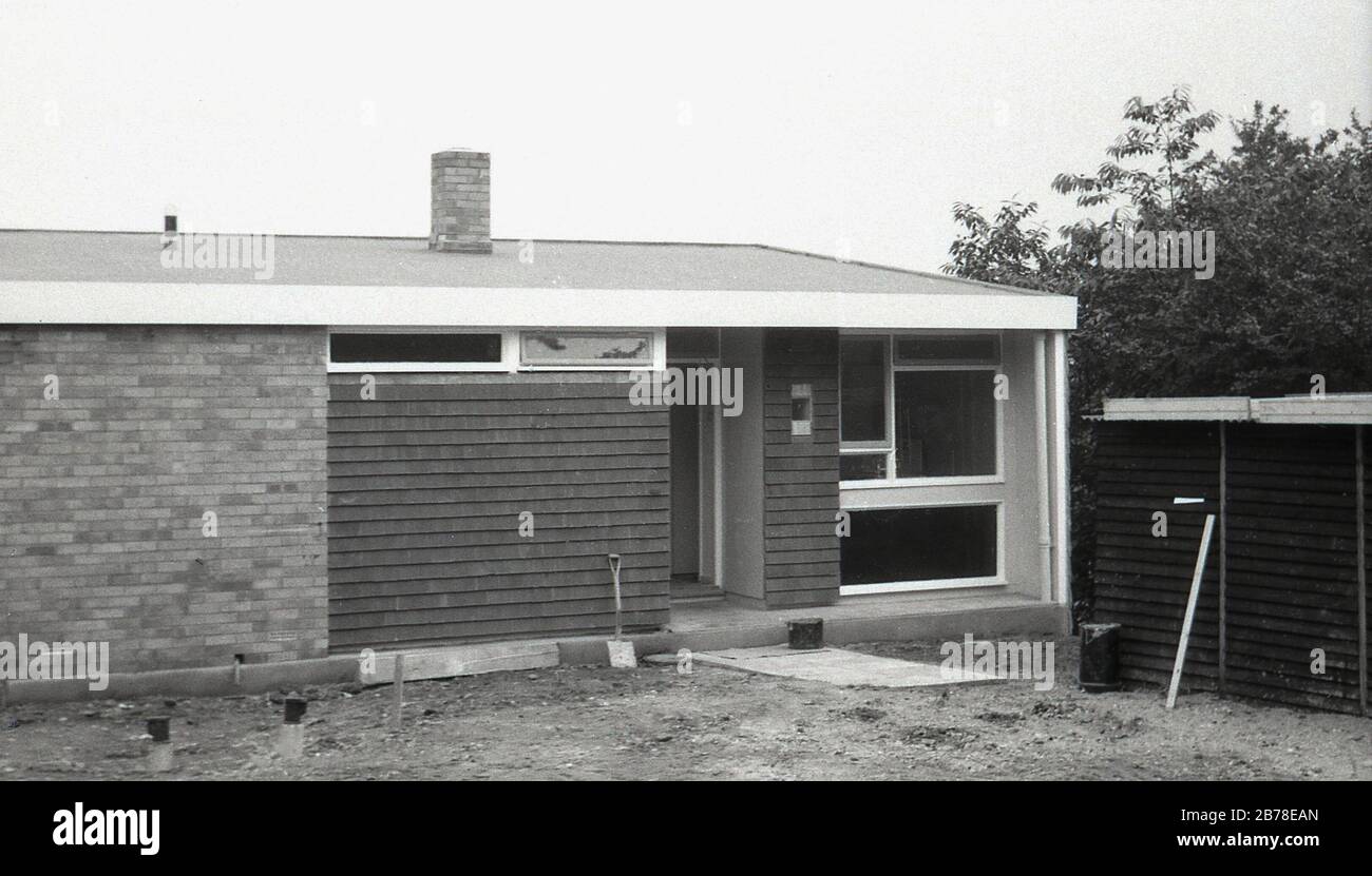 Late 60s, possibly early 70s, recently built, a new, modern single-storey house, a bungalow, with a mixed brick and tile clad exterior, showing the architectural style and design of such low-level buildings in this era, which used a number of mixed building designs and pre-built window panels, England, UK. Stock Photo