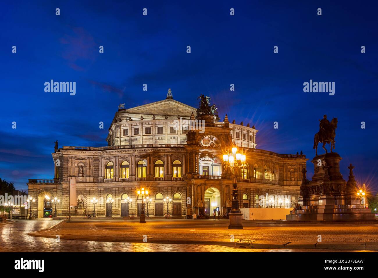 The famous opera house Semperoper lit in Dresden during blue hour Stock Photo