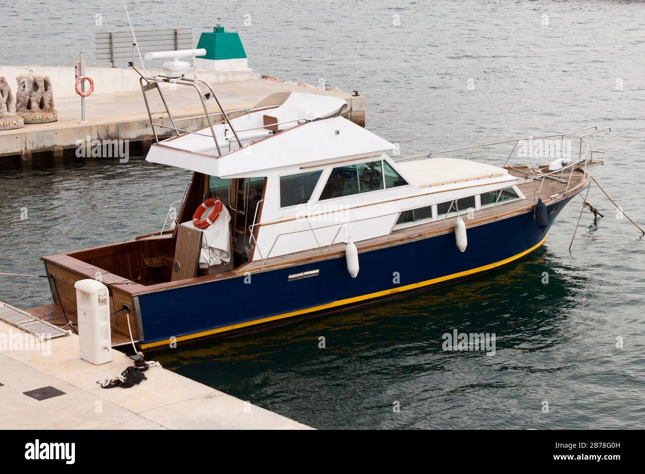 Recreational old wooden yacht  moored in the pier. Stock Photo