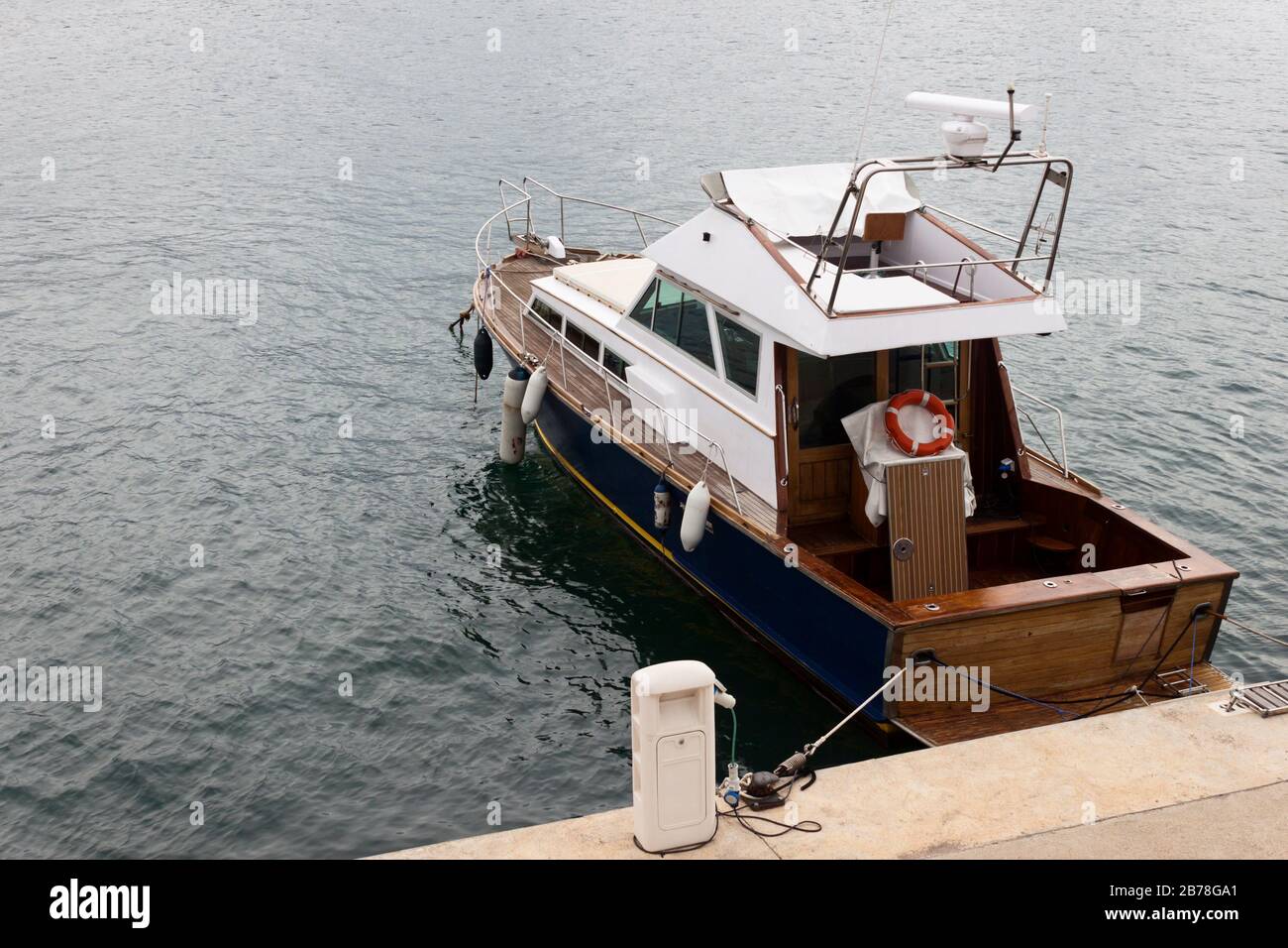 Recreational old wooden yacht moored in the pier Stock Photo - Alamy