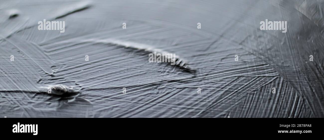 Dark gray background, charcoal paint texture as abstract backdrop