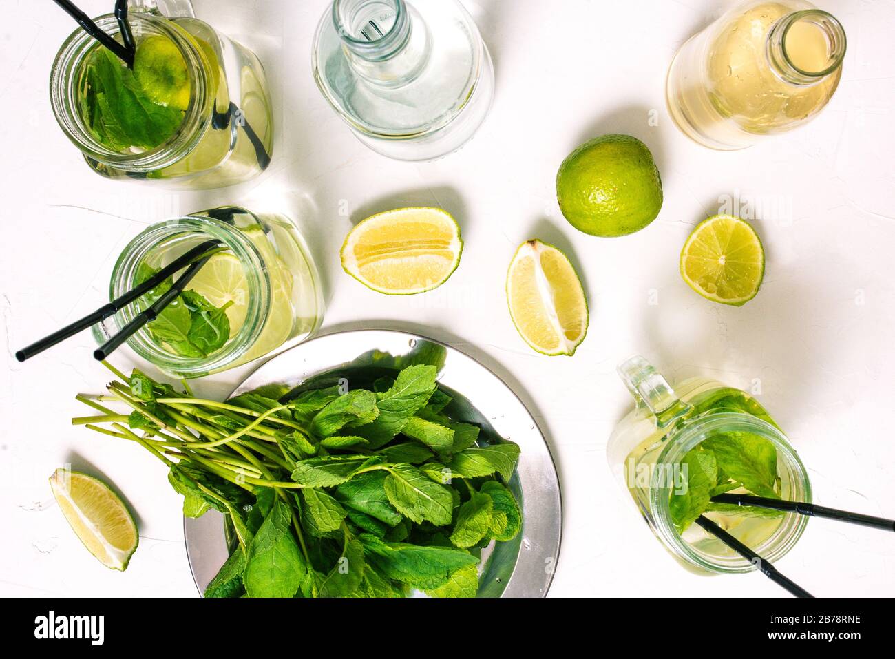 Cooking Mojito. The composition of the drink, sparkling water, rum