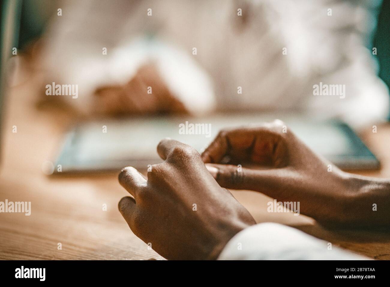 African Business Woman's Hands Going To Sign Documents Stock Photo