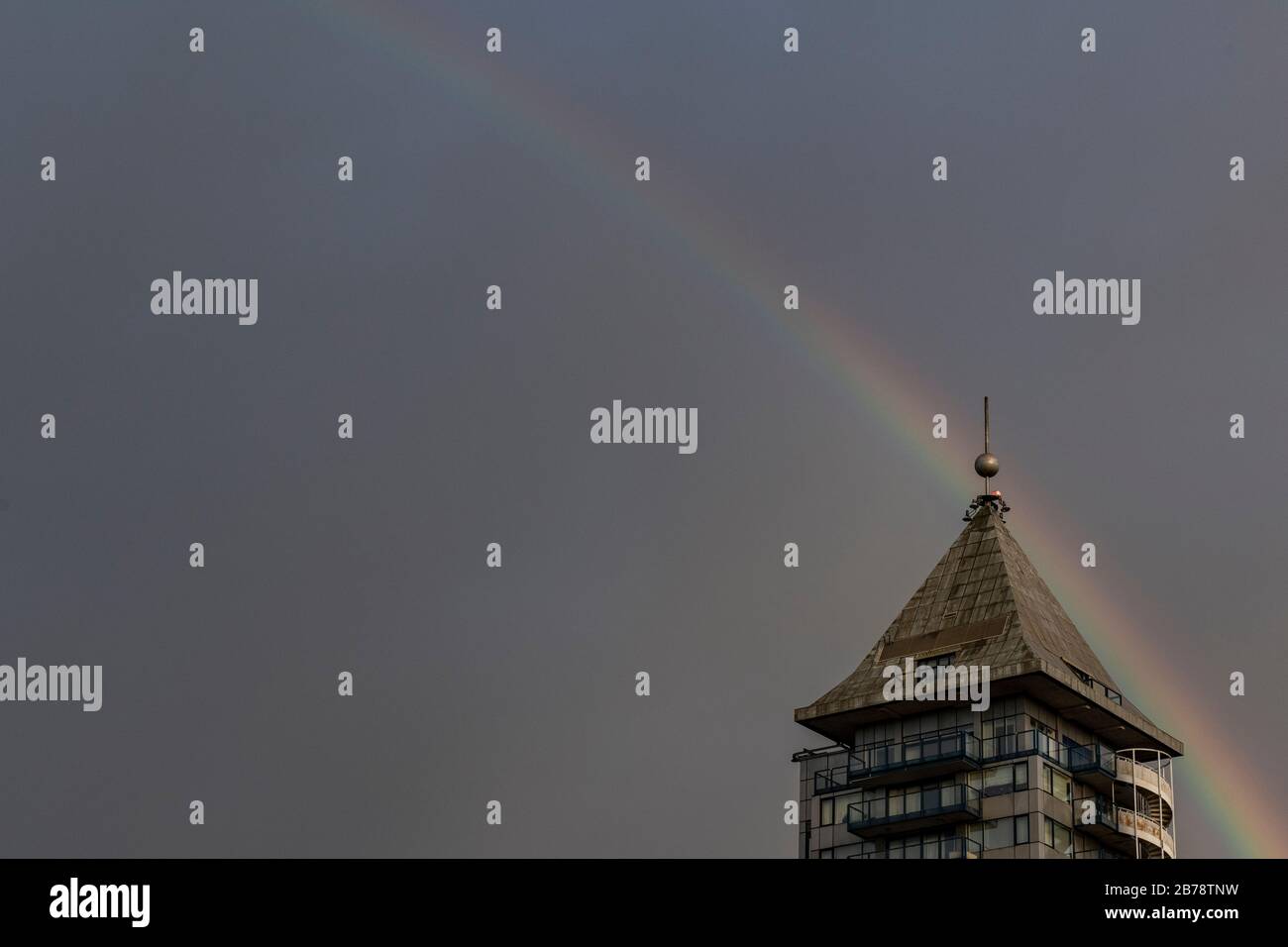 A rainbow over the Belvedere Tower, Chelsea Harbour, London, home to many famous actors, singers and sports celebrities Stock Photo