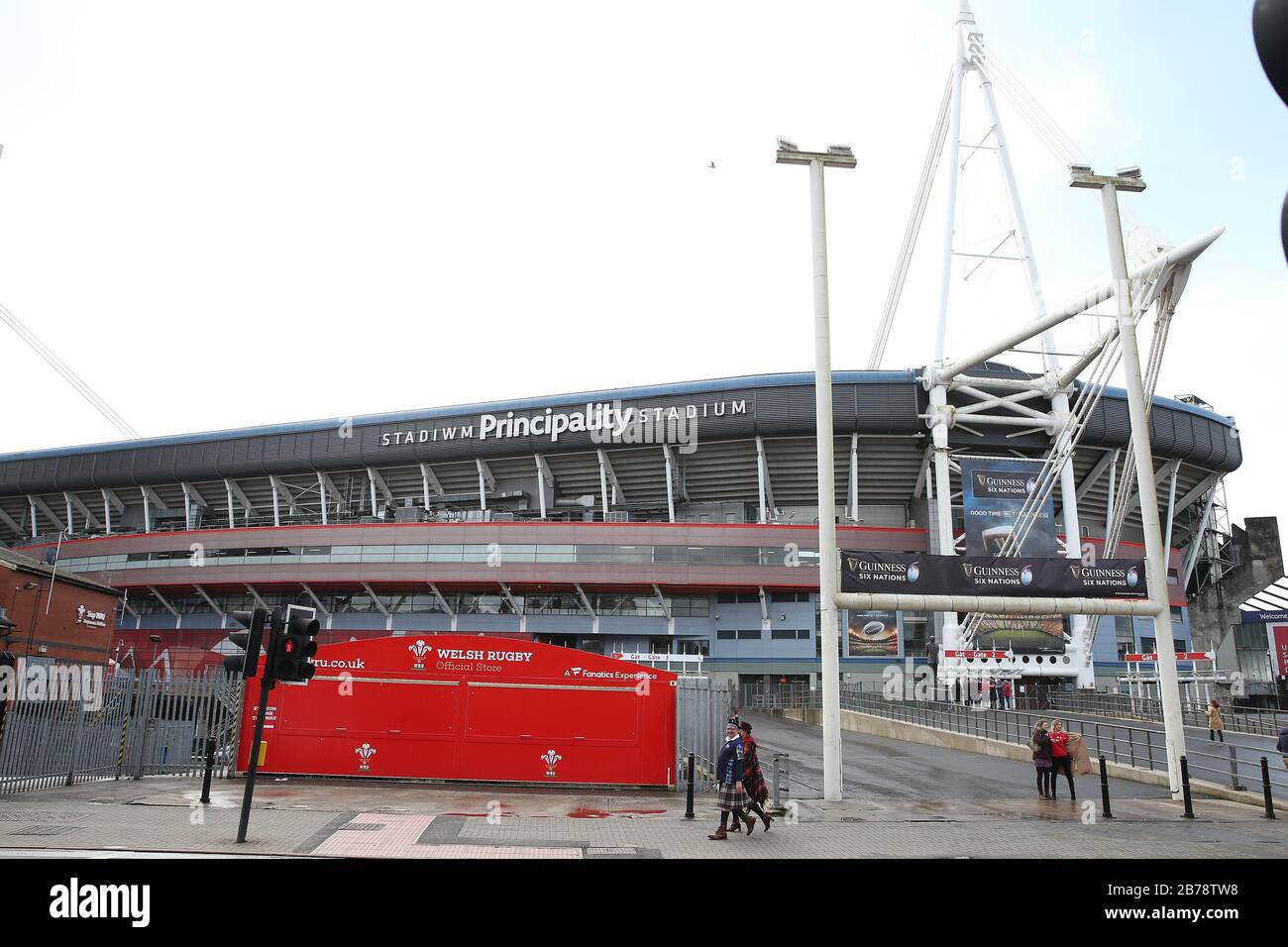 Cardiff, UK. 14th Mar, 2020. Fans outside the Principality Stadium in Cardiff ,South Wales on Saturday 14th March 2020  . They would have been inside the stadium watching the Wales v Scotland six nations match which was cancelled yesterday because of the coronavirus situation.  The WRU Store is seen shut up. pic by Andrew Orchard/Alamy Live News Stock Photo