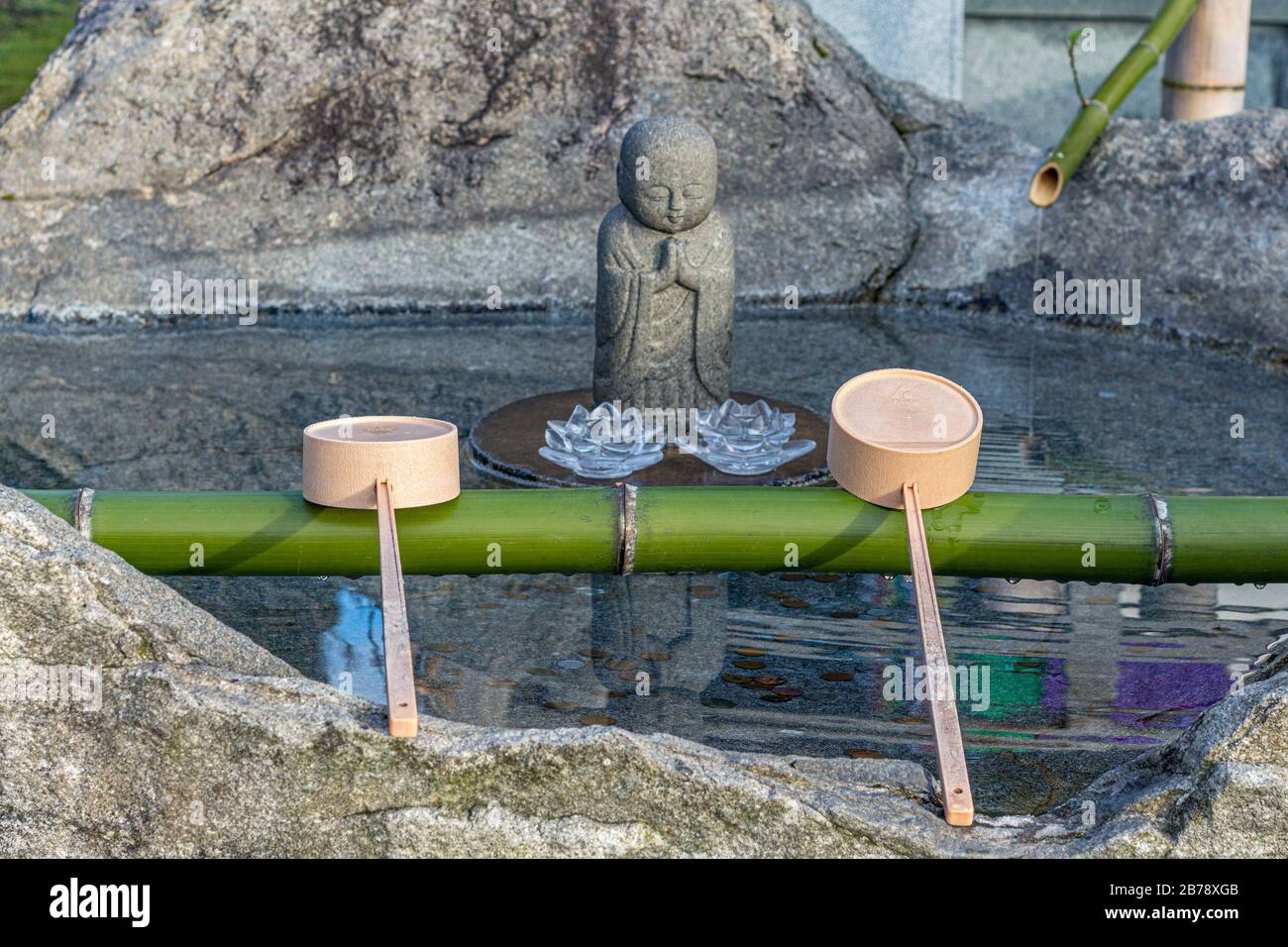 Water and ladles (hishaku) for the ceremonial washing of hands rite ...