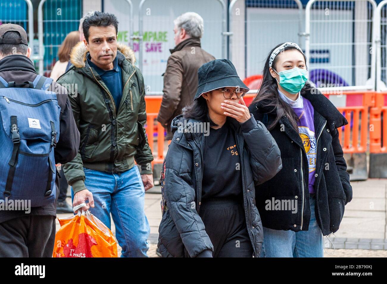 Coventry, West Midlands, UK. 14th Mar, 2020. The Coronavirus pandemic forced shoppers to wear protective masks in Coventry city centre this afternoon. Credit: Andy Gibson/Alamy Live News Stock Photo