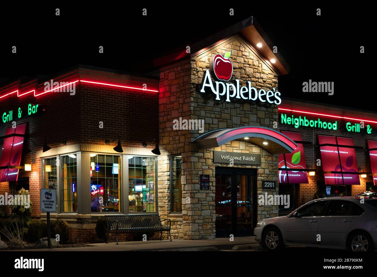 HUDSON, WI/USA MARCH 8, 2020 Applebee's restaurant at twighlight and trademark logo Stock