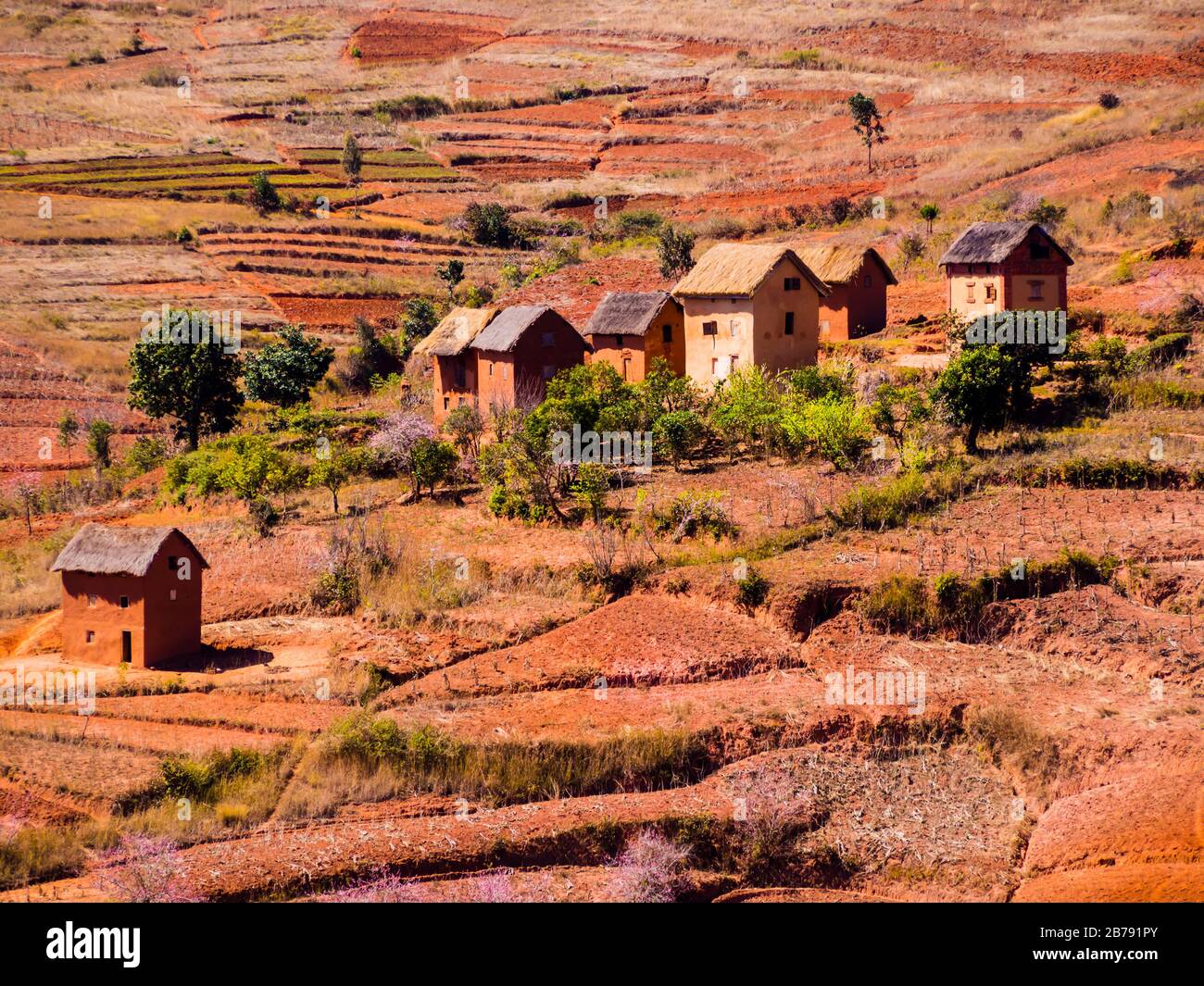 Panoramic view of typical bara village (with houses made of mud and straw) in the countryside of the National Route 7 near Antsirabe, Madagascar Stock Photo