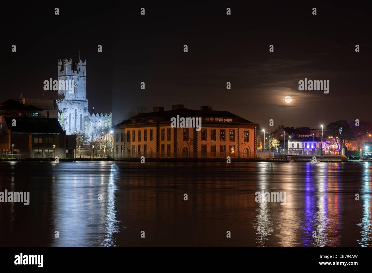 The rising moon in Limerick City with court house and St Mary's ...