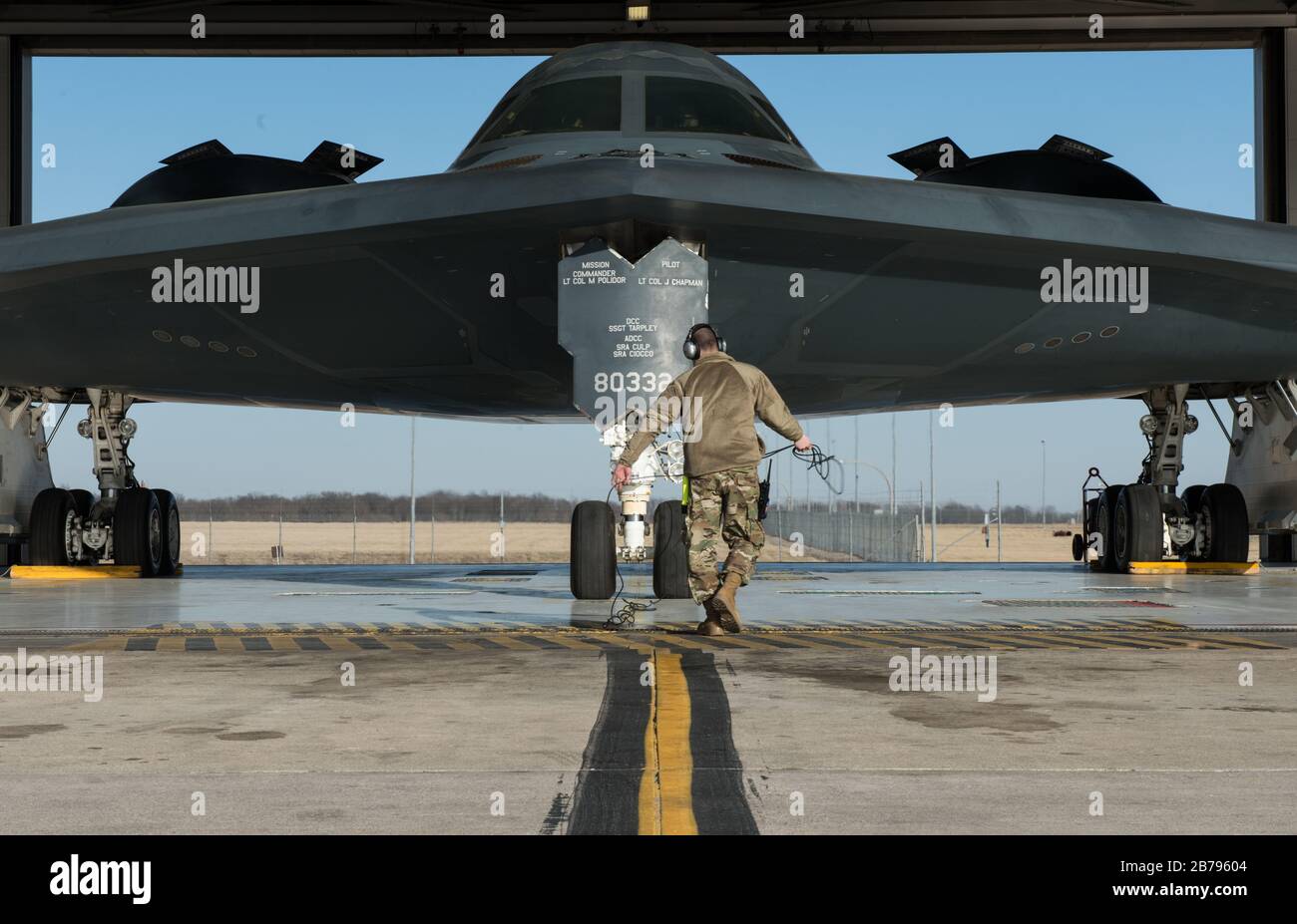 U.S. Air Force Tech. Sgt. Justin Aeckerle, a B-2 Spirit crew chief assigned to the 131st Maintenance Squadron, prepares a B-2 Spirit stealth strategic bomber for departure at Whiteman Air Force Base for relocation to England March 8, 2020 in Knob Noster, Missouri. Stock Photo