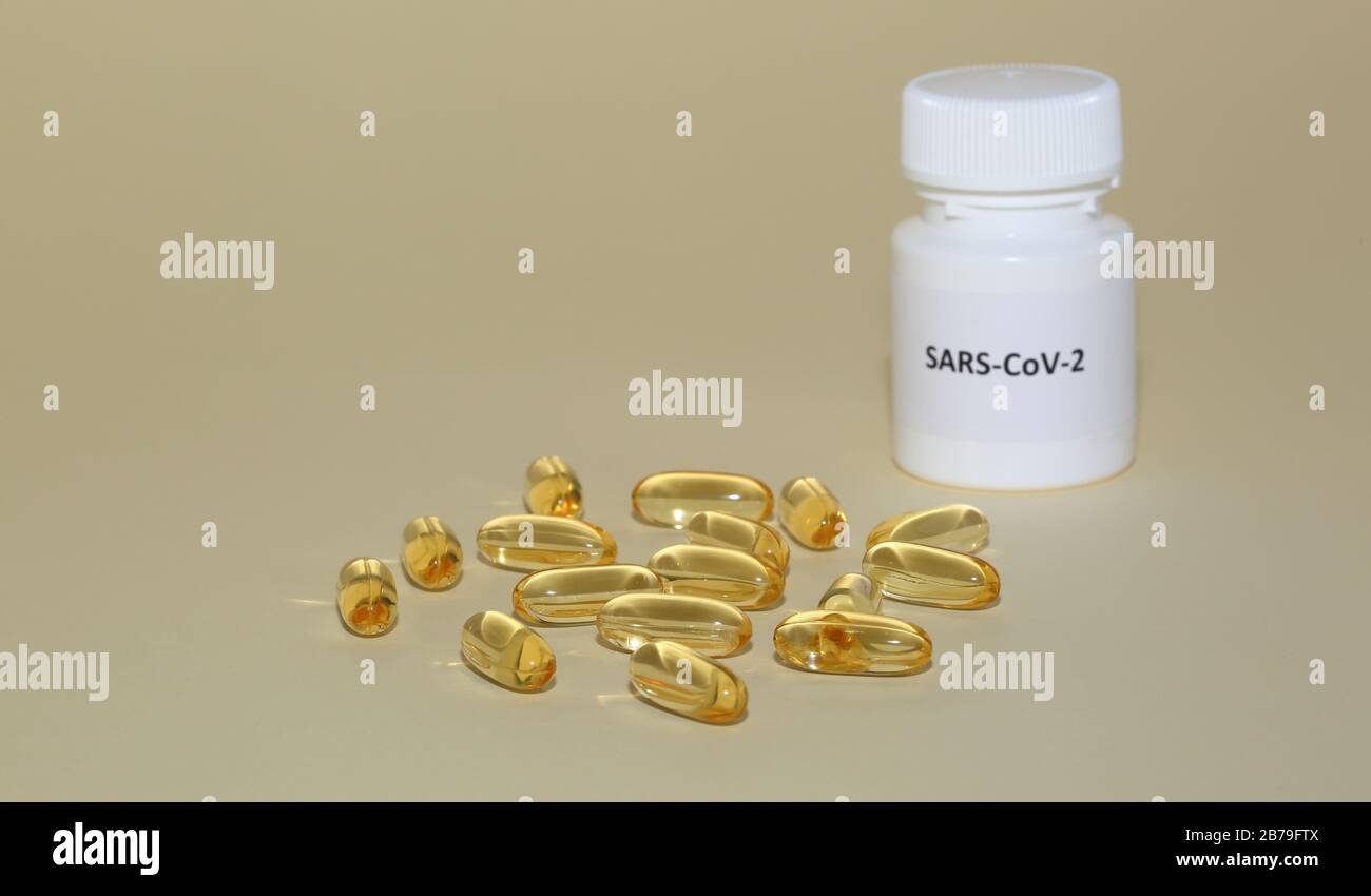 Yellow gel capsules omega 3 acids vitamine d3 with pharmaceutical plastic bottle close up isolated on pastel color background Stock Photo