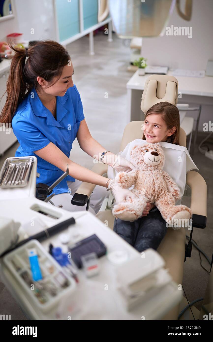 Child with female dentist in dental office Stock Photo
