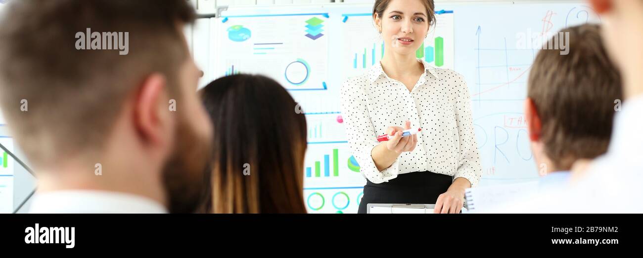 Smiling beautiful woman in office telling something important Stock Photo