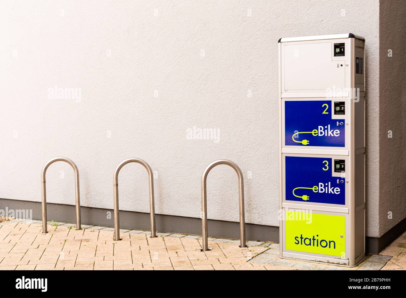 Electric bicycle charging point. Care for the environment. Ecological transport. Urban infrastructure in Bavaria, Germany. Stock Photo