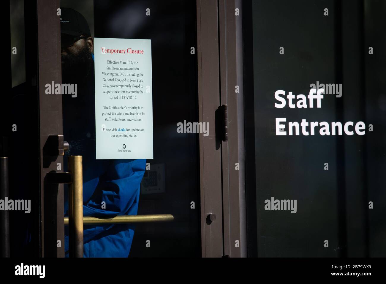 Washington, USA. 14th Mar, 2020. Washington, USA. 14th Mar, 2020. A 'Temporary Closure' sign is seen taped to an entrance to the National Museum of African American History and Culture C part of the Smithsonian Institution, which closed all of its museum locations on March 14 in response to the worsening global COVID-19 outbreak C in Washington, DC on March 14, 2020. On Friday, President Donald Trump declared a National Emergency and a major relief bill was passed by the House of Representatives, both targeted at the ongoing Coronavirus pandemic. (Graeme Sloan/Sipa USA) Credit: Sipa USA/Alamy  Stock Photo