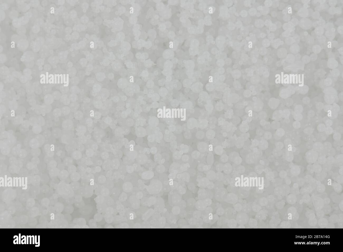 White small balls background. Texture of polystyrene granules Stock Photo