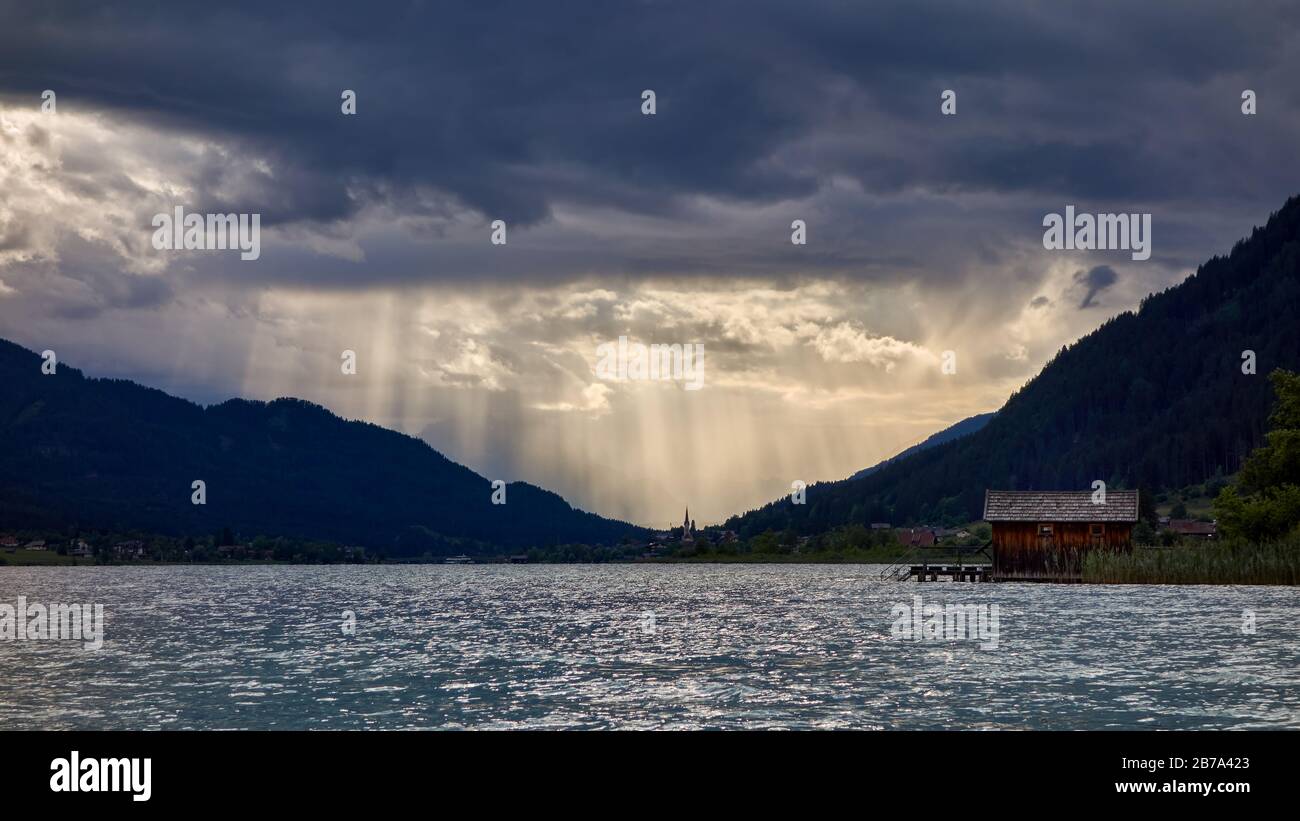 landscape with lake and mountains with godrays Stock Photo