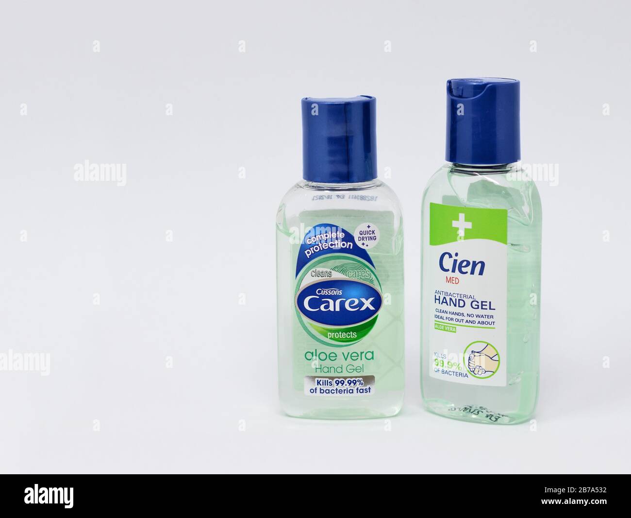 London / UK - March 9th 2020  - Two bottles of antibacterial hand sanitiser gel from Carex and Cien brands on a white background Stock Photo