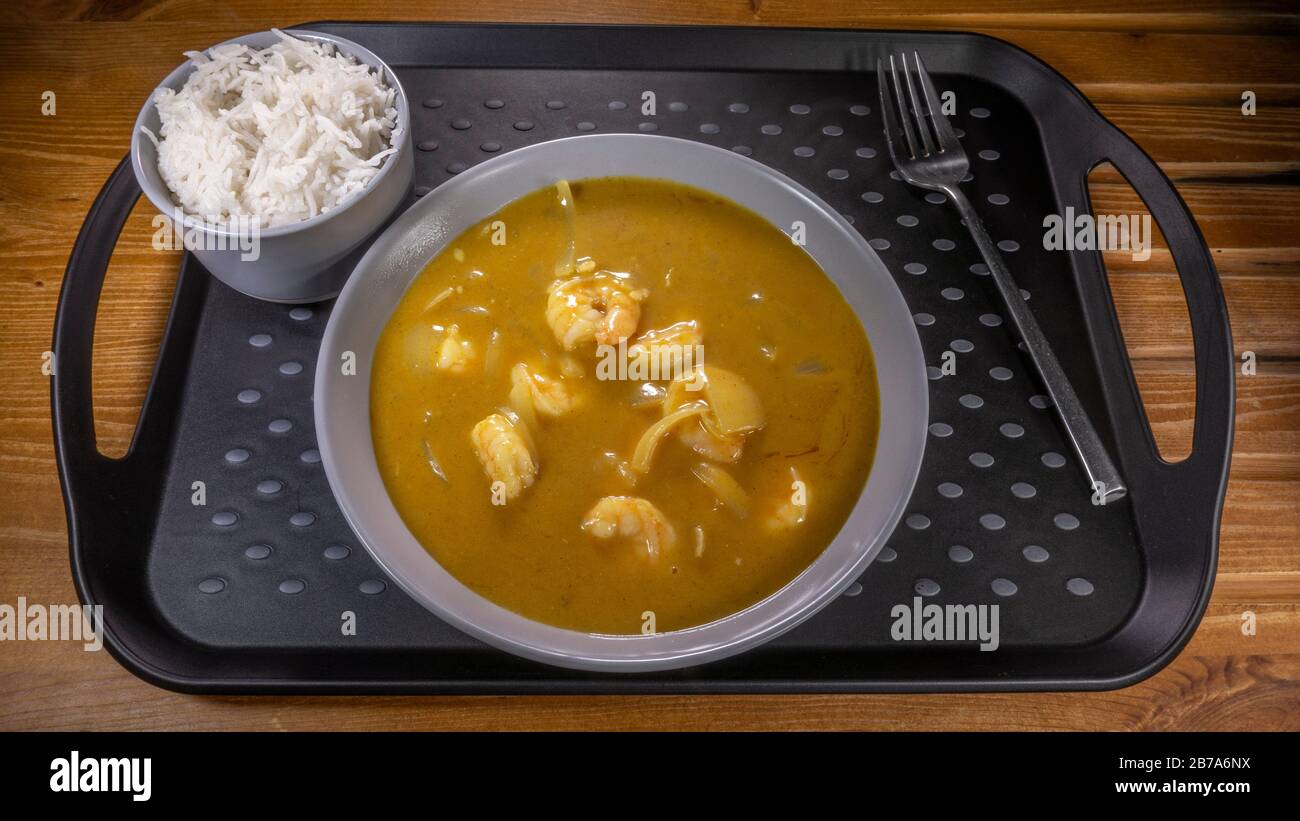 A bowl of thick Chinese king prawn takeaway / takeout curry on a