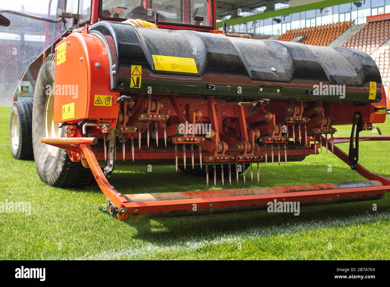 Detail of aeration machine during grasslands football field Stock Photo