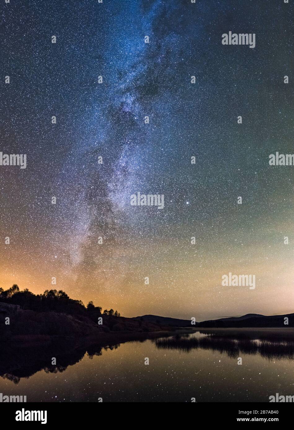 Milky Way and stars over Loch Stroan, Galloway Dark Sky Park, Galloway Forest, Dumfries & Galloway, Scotland Stock Photo