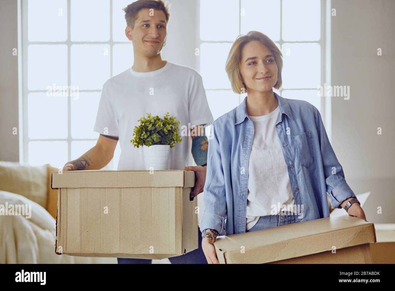 happy Young couple moving in new home Stock Photo - Alamy