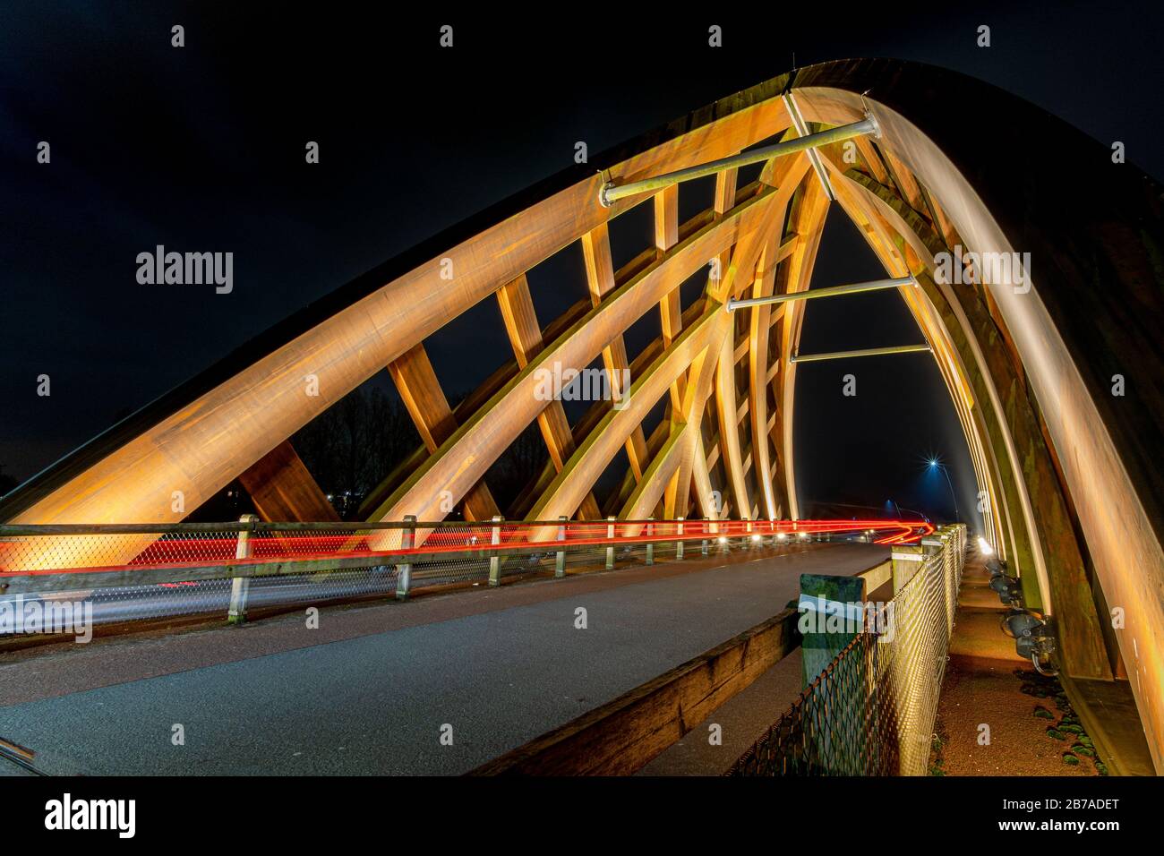 Sneek, Netherlands, September 2020. Perpendicular view of a bridge with a span made of curved wooden beams, without traffic Stock Photo