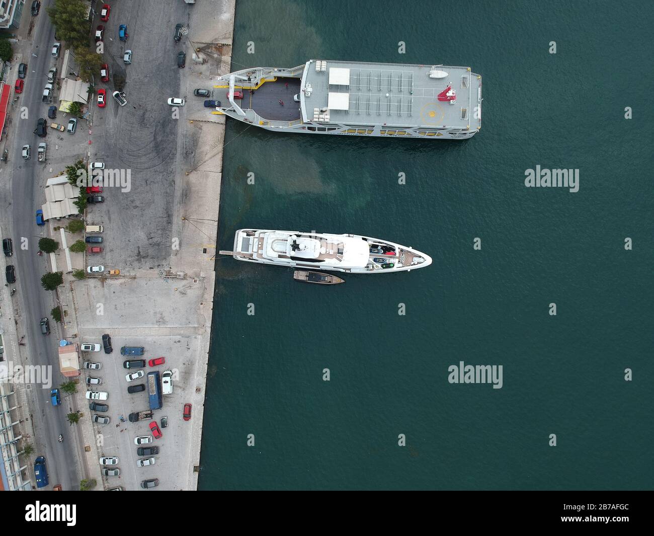 aerial view luxury yach ouranos and speed boat anchored beside of corfu ferry ship in yacht