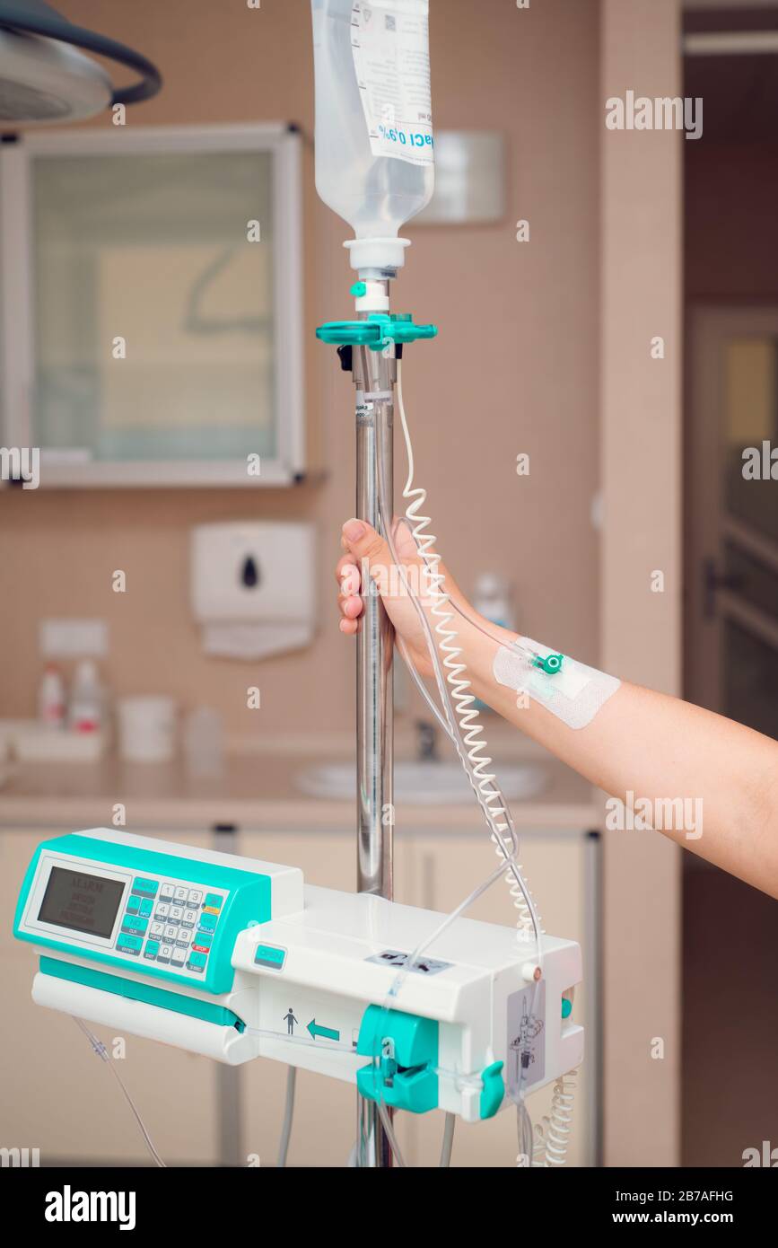 Iv fluid, intravenous with sodium chloride applying to the patient in the hospital. Stock Photo