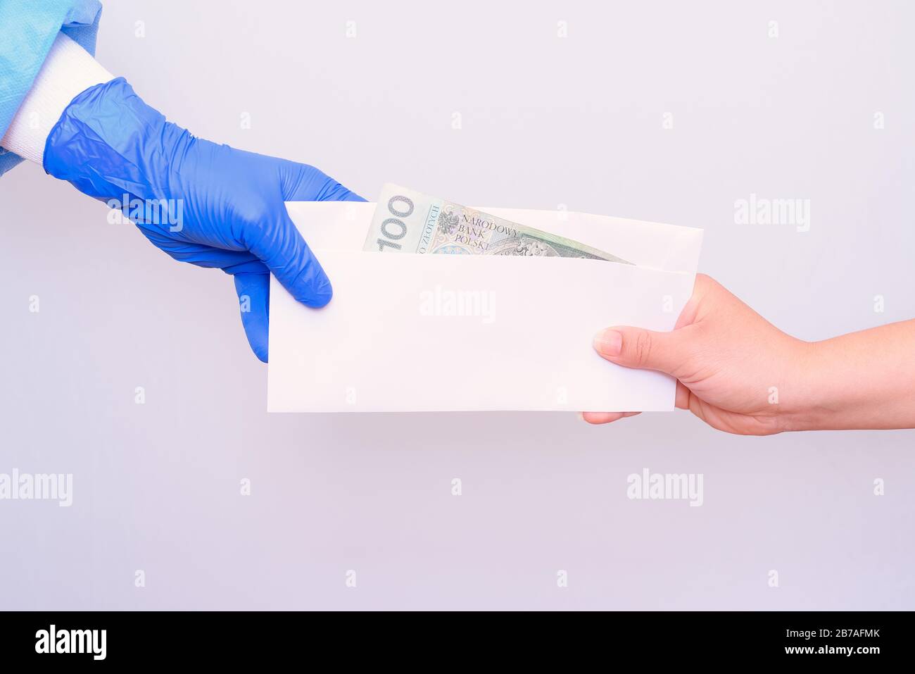 Bribery. Corruption in the medical health care industry. Accepting cash in the hospital. Stock Photo