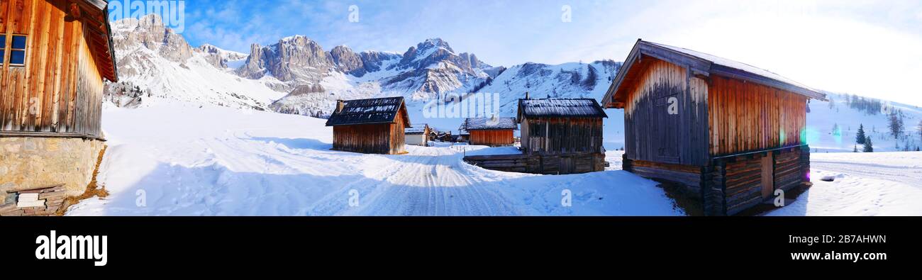 Fuciade San Pellegrino village wooden houses in winter time in dolomites in Italy in snowy day panorama landscape Stock Photo