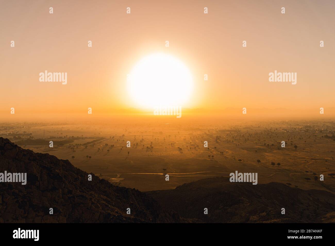 Sun Rise from the Fossil Rock in Sharjah Stock Photo