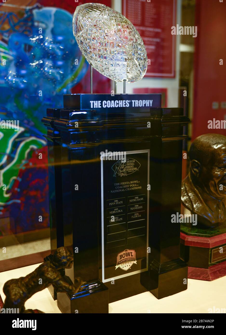 Inside a case, A crystal cut football atop the Coaches trophy for the Fiesta Bowl Coaches National Championship, at Zigler's Museum, Scottsdale, AZ Stock Photo
