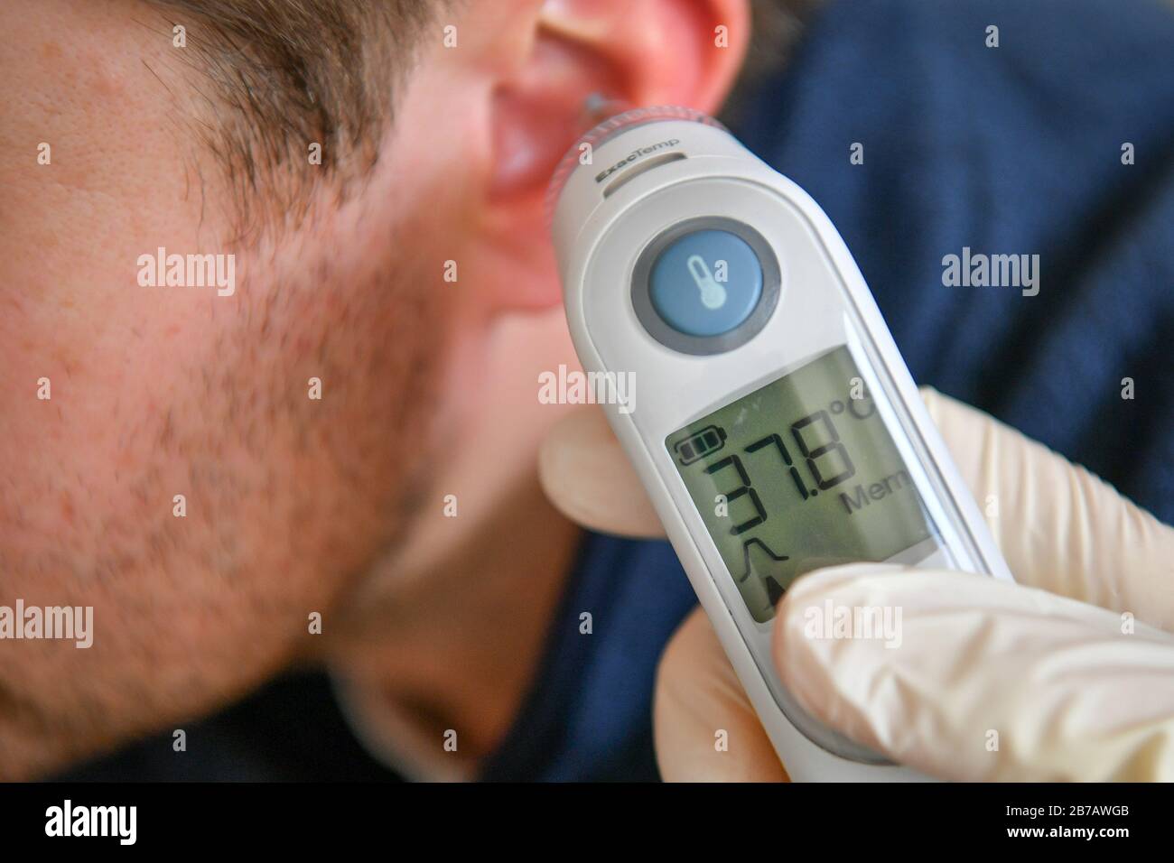 PICTURE POSED BY MODELA body temperature of 37.8 degrees Celsius is recorded on a tympanic thermometer. PA Photo. Picture date: Saturday March 14, 2020. Photo credit should read: Ben Birchall/PA Wire Stock Photo